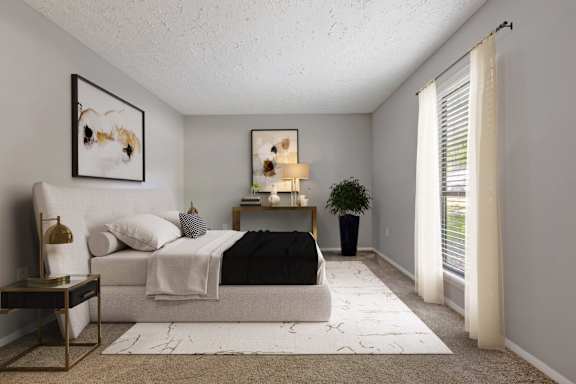 A bedroom with a bed, nightstand, and a painting on the wall.