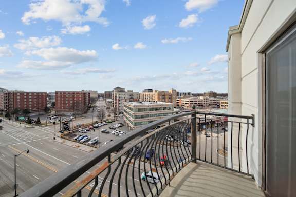 apartment balcony with seating and views from River 595 Apartments