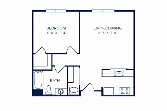 A floor plan of a small apartment with a bedroom, living/dining area, and bathroom.
