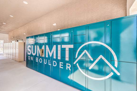 A wall with Summit on Boulder written on it.