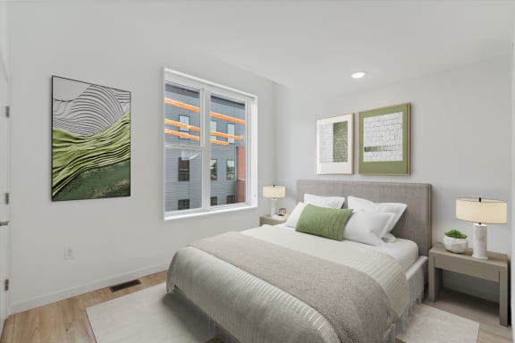 a bedroom with a large bed and a window