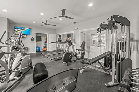 Fitness Center with treadmill, weights, and ellipticals available at Gateway of Grand Blanc