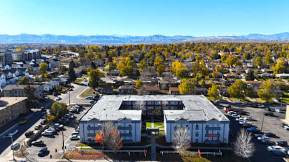 A view of a town with a large building in the center.