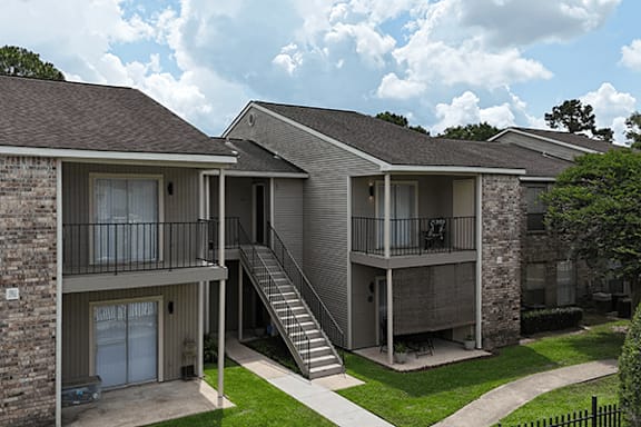 Apartment building with a staircase leading to the second floor.