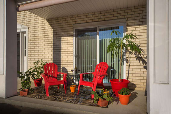 private patio with chair and plants
