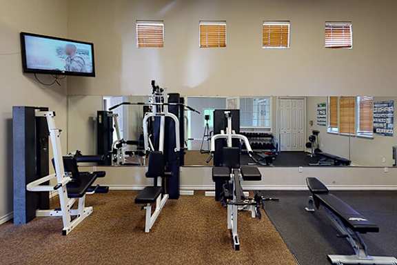 Fitness center at Ashton Pointe apartments