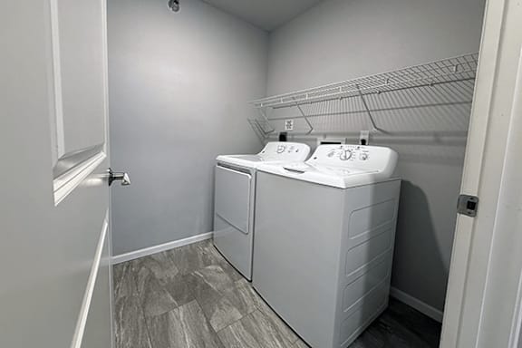 A bathroom with two sinks and a walk-in shower.
