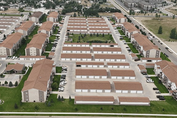 A large housing complex with multiple buildings and parking lots.