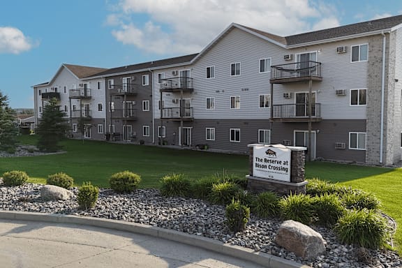 A large building with a sign that says "The Reserve at High Crossing".