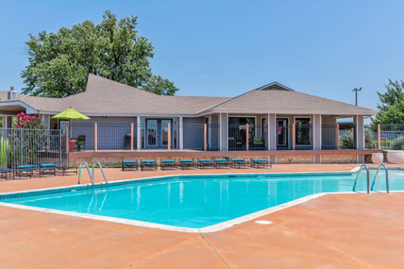 a swimming pool in front of a building