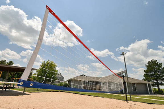 a large volleyball court in front of a house