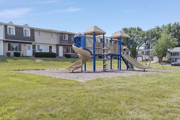 a playground with a slide and monkey bars