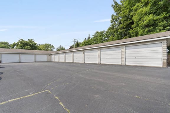 a row of garages in a parking lot