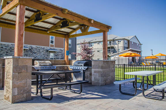 our apartments offer a clubhouse with a picnic table and grill