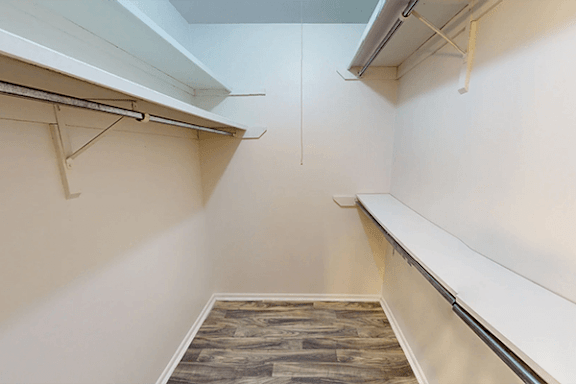 A room with a wooden floor and white walls.