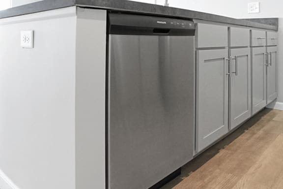 A modern kitchen with a stainless steel dishwasher.