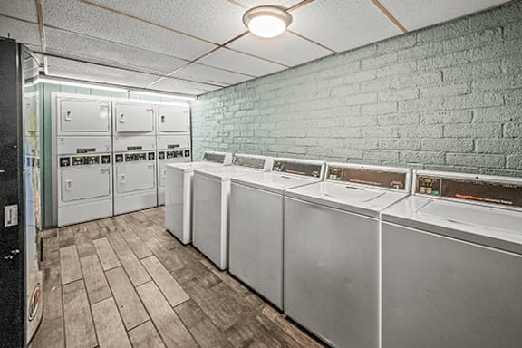 A row of washing machines in a laundromat.