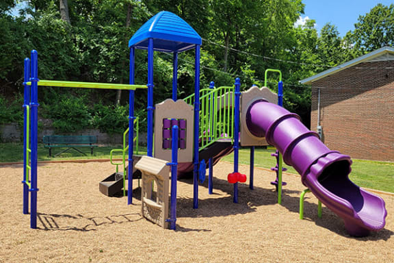 a playground with a slide and other play equipment