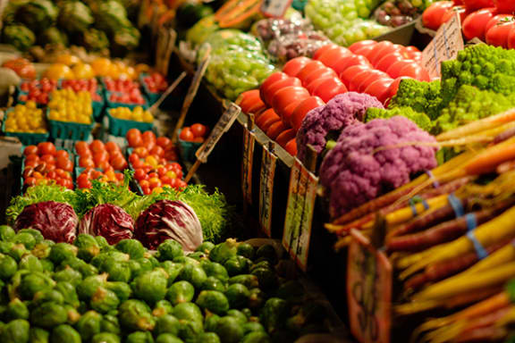 a display of vegetables at a grocery store