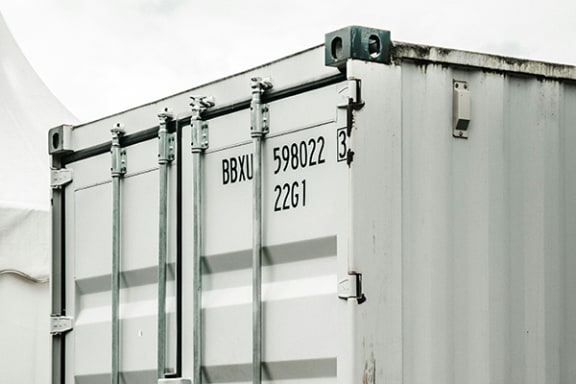 the side of a shipping container with its doors closed