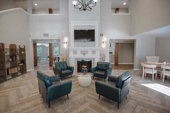 A living room with a fireplace and a couch.