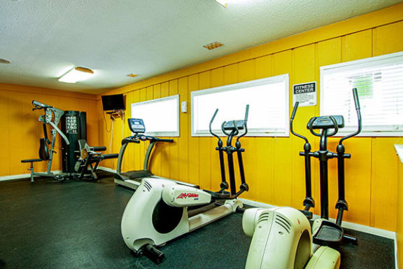 a room filled with lots of exercise equipment