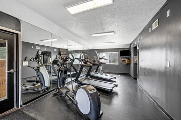 convenient on-site fitness center with a treadmill