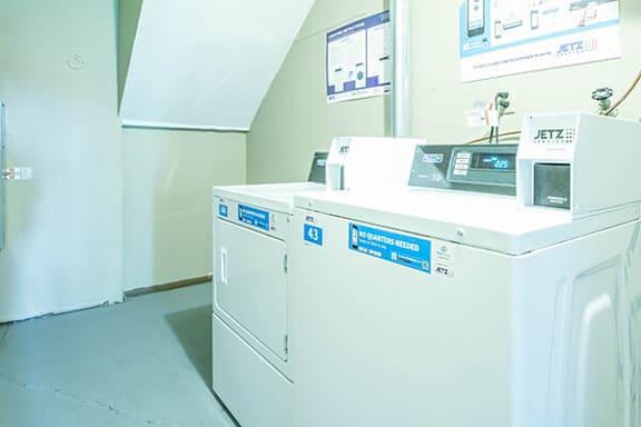 A washing machine in apartment laundry center