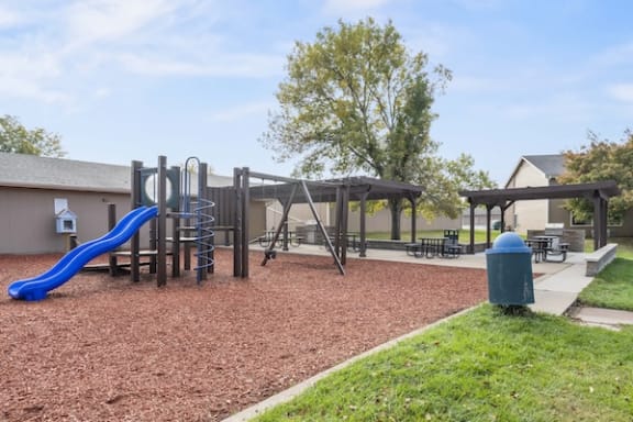 our playground is equipped with a variety of toys and picnic tables