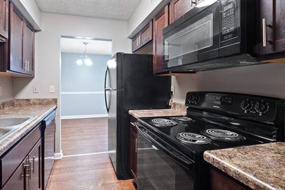 Refrigerator in kitchen at huntley ridge clarksville aprtments