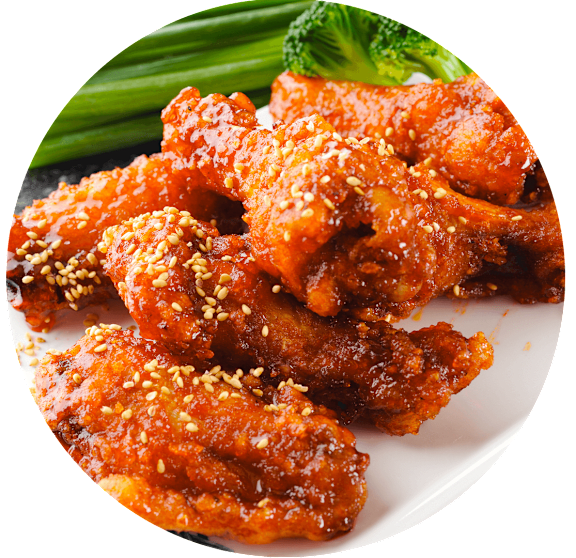 A plate of chicken wings topped with sesame seeds.