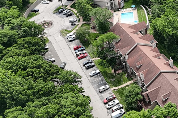 A residential area with houses and cars.
