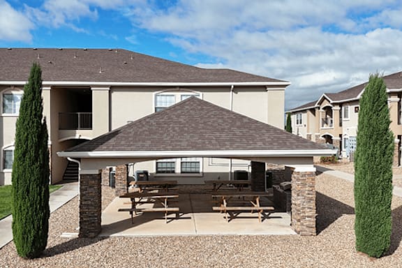 A house with a patio and a picnic table.