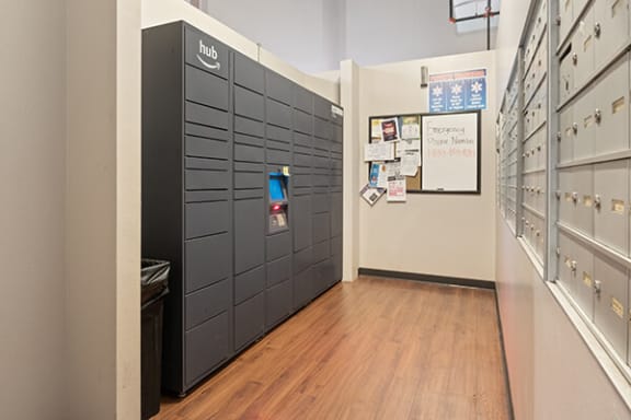 a row of lockers in a room with a wood floor