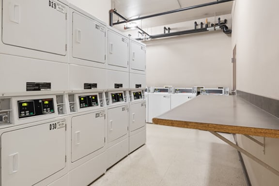 a room with many white machines and a table