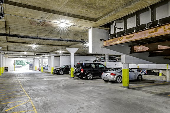 A parking garage with cars parked in it.