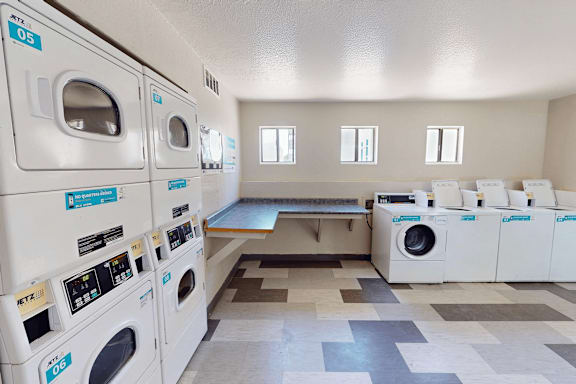 A laundromat with washers and dryers.