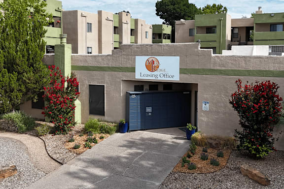 The image shows a building with a sign that reads "Leasing Office".