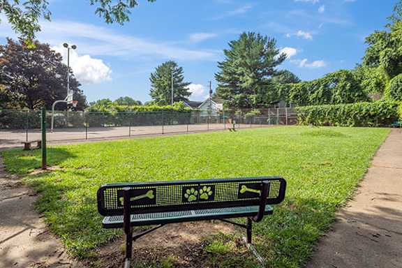 dog park with bench at McMillen Woods Apartments