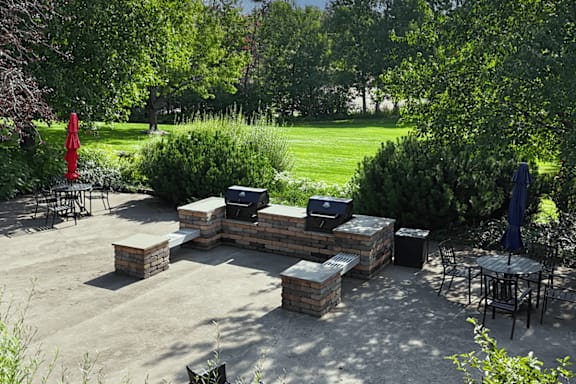 A backyard with a fire pit and seating area.