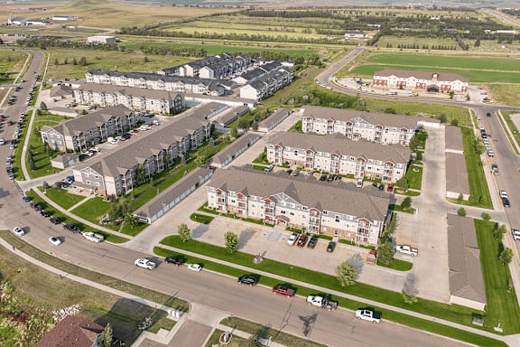A large apartment complex with multiple buildings and parking lots.