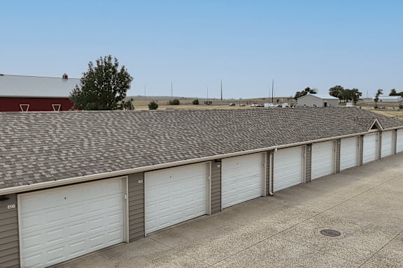 A long row of garage doors are closed.