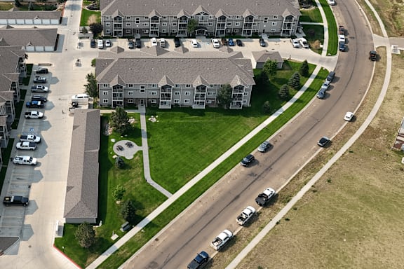 A large building with a parking lot in front of it.
