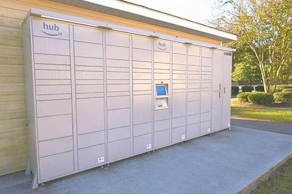 A row of package lockers with the word Hub on them.
