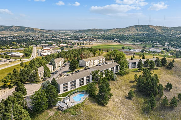 A bird's eye view of a resort with a swimming pool.