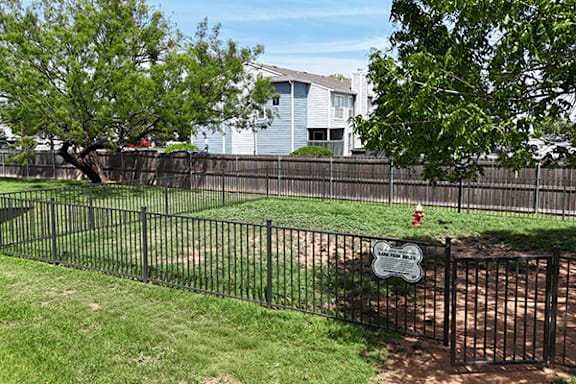 A baseball field with a sign that says "Baseball Only" on it.