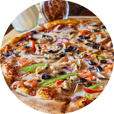 A pizza with various toppings like mushrooms, peppers, and olives.