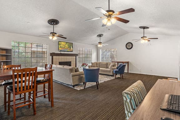a  club house seating area with a fireplace