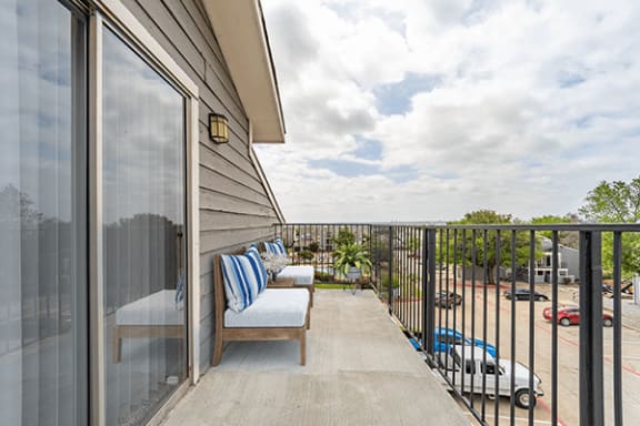 take in the view from the balcony at the Summit on the Lake Apartments