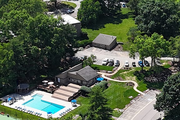 A large house with a pool in the backyard.